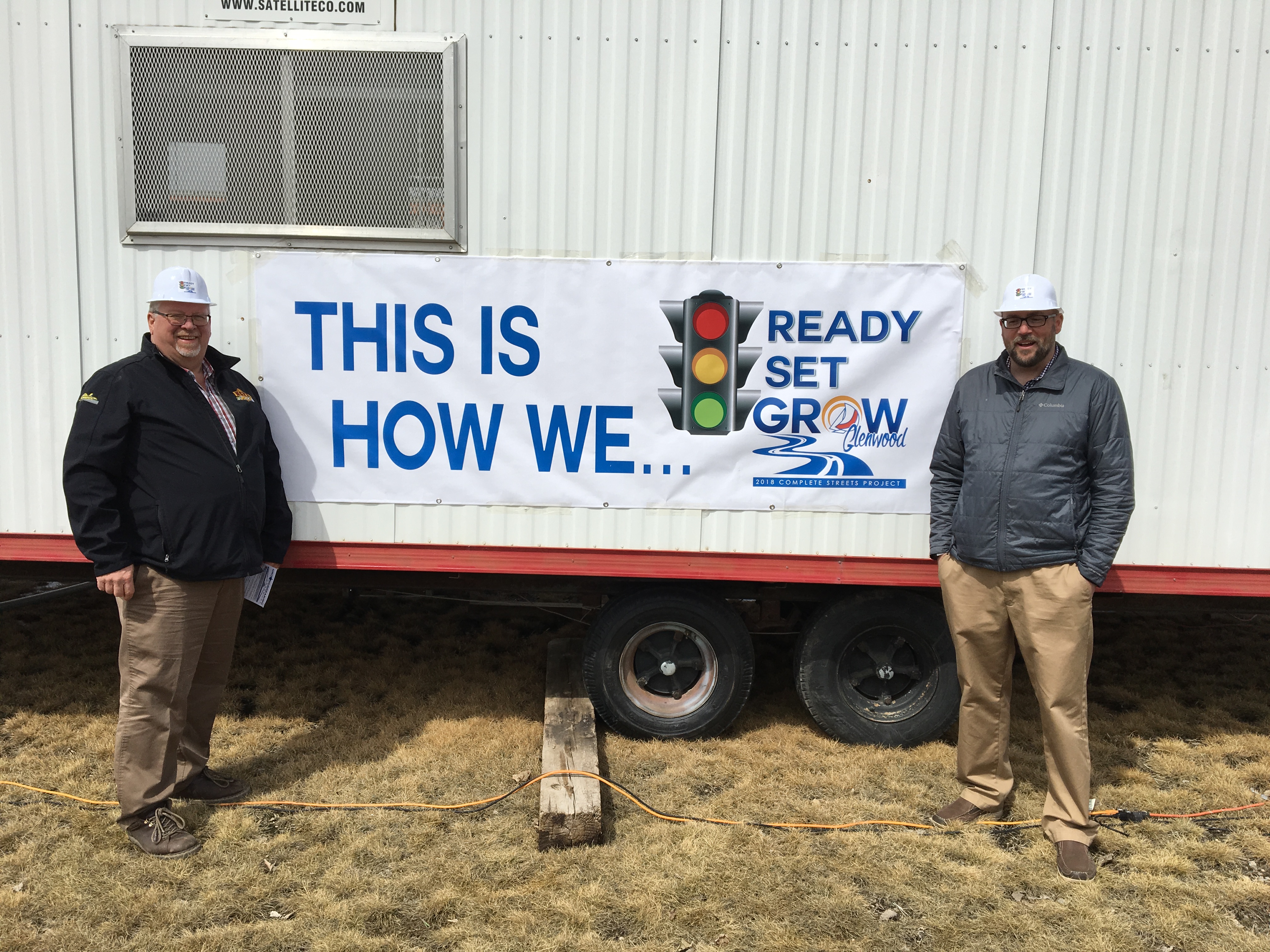 Mark Welling, standing in front of a trailer near Brad Cegla.